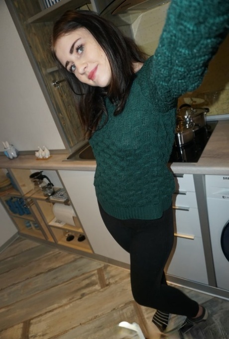 Dark-haired cutie posing butt naked and in her sexy lingerie in a solo