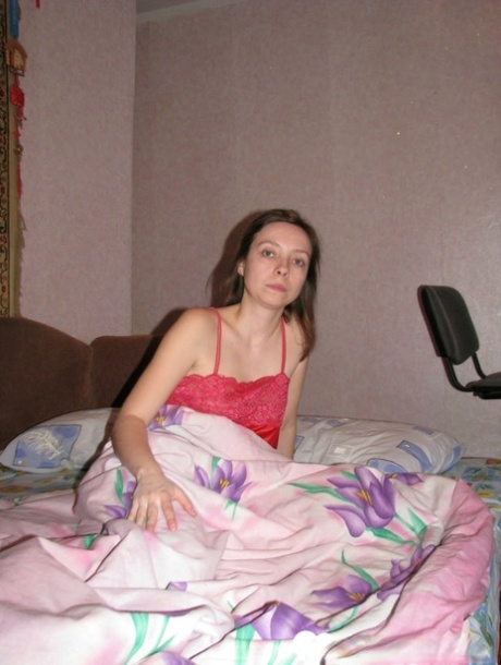 All-natural brunette strips off her silky nightgown and poses naked