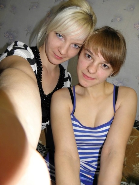 Lesbian babes strip and suck each other's tits while taking selfies