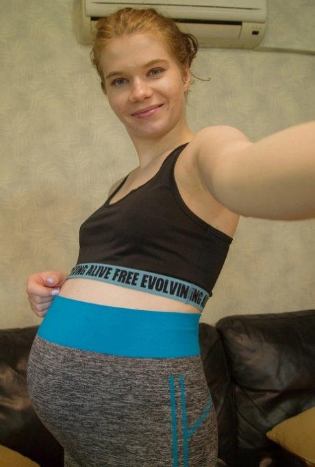 Naughty pregnant babe takes nude selfies showing her small tits