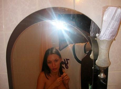 Tall amateur Aurita poses naked during candid action around her palce