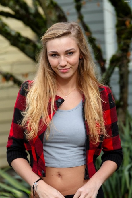 Nerdy college girl pulls down her legging on sidewalk and in school library