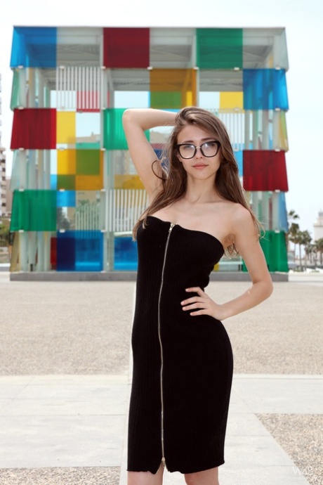 Nerdy teen Milla shows her tits and ass on a lookout spot over her town