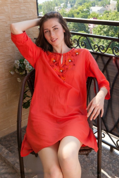 Young European brunette Rosett flashing up skirt pussy outdoors on balcony