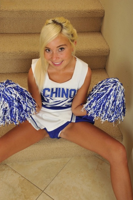 Blonde cheerleader Kaylee Hayee fingers on the stairs & licks her pussy juices
