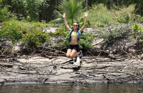 Petite Latina babe Holly Hendrix strips and poses sexily on the boat