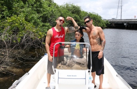 Petite Latina babe Holly Hendrix strips and poses sexily on the boat