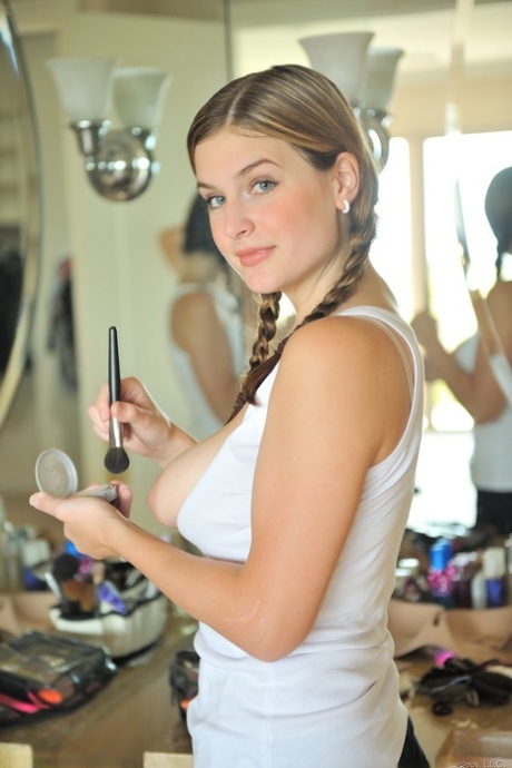 Beautiful amateur Danielle shows off her juicy tits in a hot striptease