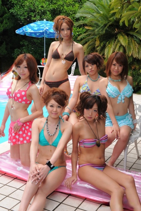 Sweet Japanese girlfriends in sexy swimsuits flaunt their beauty poolside