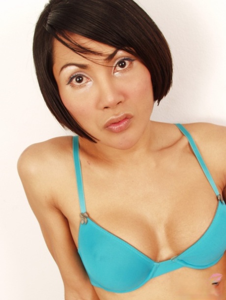 Gorgeous Asian shemale MILF Golf flaunts her curved cock in sexy lingerie