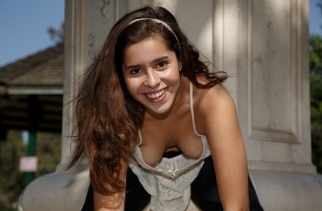 American teen Sabrina Reyes exposes her bare ass between library stacks