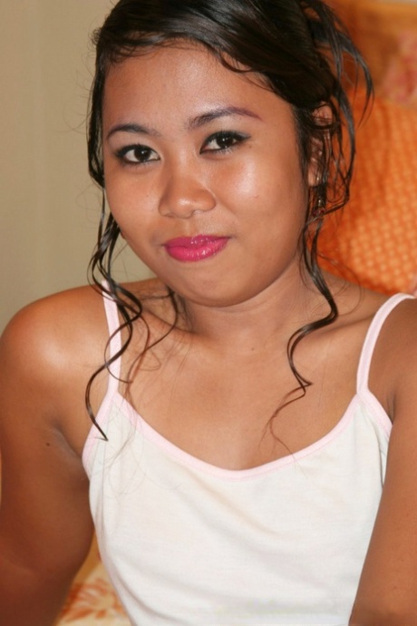 Chubby Pinay amateur disrobes on a couch before sucking on a hard dick