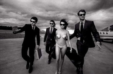 Curvy centerfold Taiana Camargo with big tits lounges nude with her cash