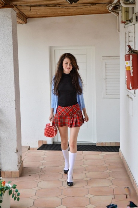 Schoolgirl smokes a cigarette prior to showing an old man her tight pussy