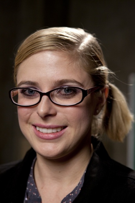 Nerdy pornstar Penny Pax shows her natural tits and poses in sheer pantyhose