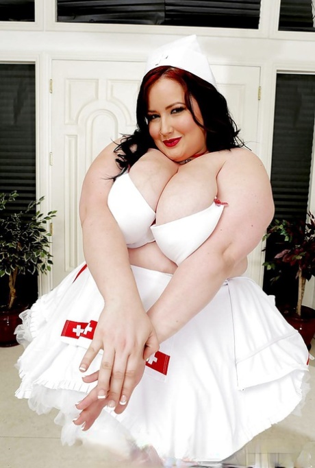 SSBBW Eliza nurse posing in heels and naughty nurse uniform