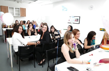 Stunning clothed ladies having a blowjob party at the office