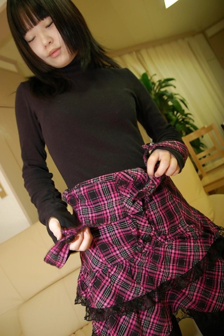 Playful asian schoolgirl Rio Takei getting rid of her clothes