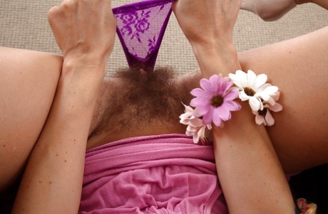 European mom French Chloe stripping naked to reveal hairy vagina