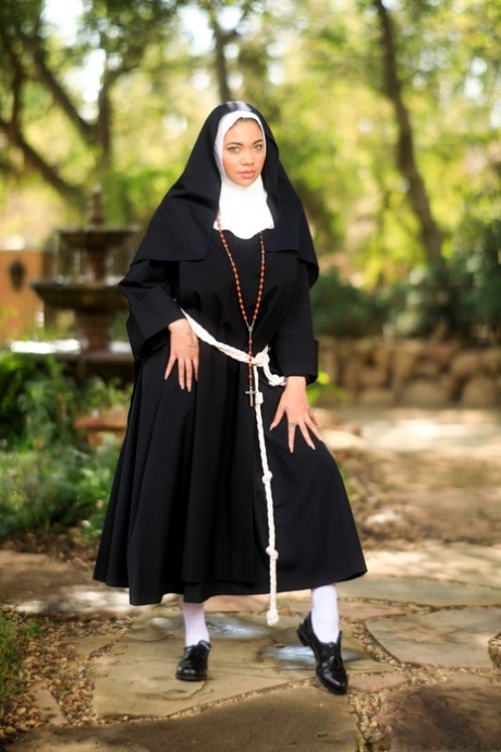 Thick nun bares her big naturals before showing her ass and twat in courtyard