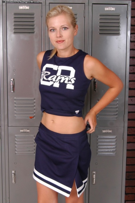 Admirable MILF slipping off her cheerleader uniform and exposing her goods