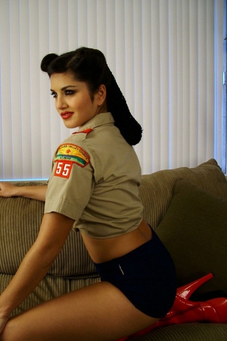 Indian MILF Sunny Leone teasing in red boots & a slutty scouting outfit