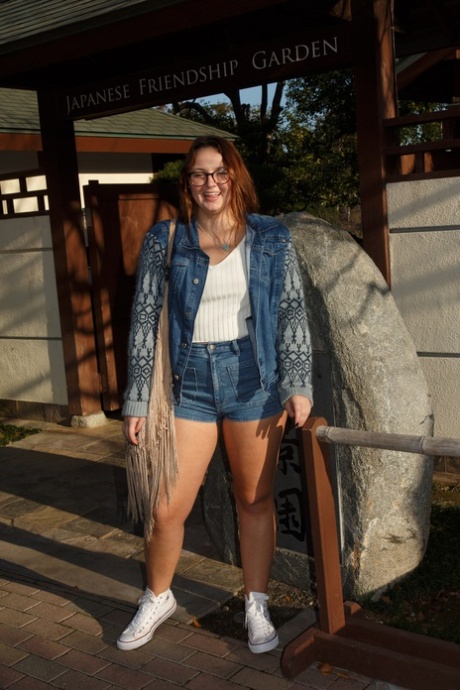 Cute brunette Tammy Kaimia flashes big round tits and juicy thighs