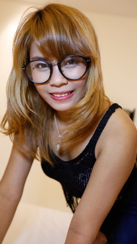 Nerdy Thai babe An happily takes a stiff cock in her tight hairy pussy