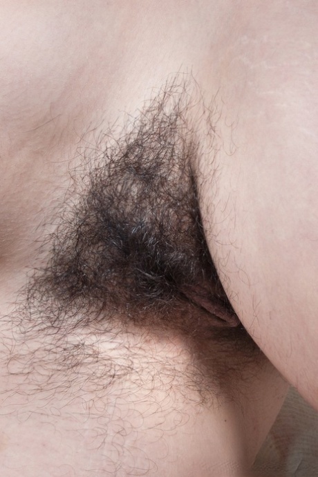 Busty amateur wife Cleo spreading her super hairy vulva on the carpet