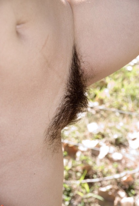 Cute young Akito removes white cotton panties outdoors to spread hairy beaver