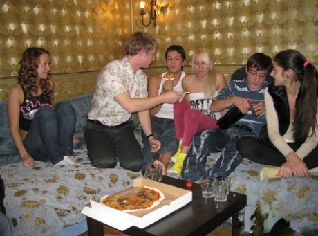 Young girls engage in group sex while attending a pizza party