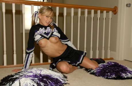 Adorable blonde teen Kasia exposes her big tits in cheerleader uniform