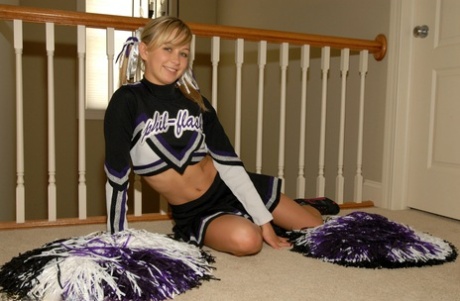 Adorable blonde teen Kasia exposes her big tits in cheerleader uniform