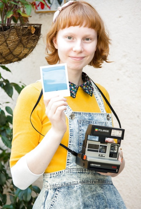 All natural redhead Emma B parting labia lips after undressing on patio