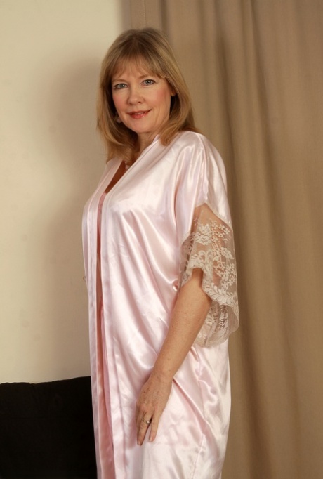 Mature mom Lilli in satin lingerie reveals big tits & rubs clit in stockings