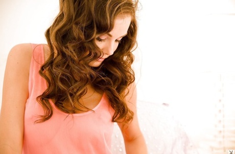 Amazyngly lovely brunette babe Hillary Fisher getting nude on the bed