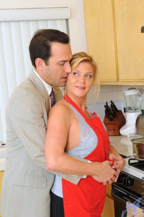 Mature lady Ginger Lynn takes a cumshot on her ass wearing tan stockings