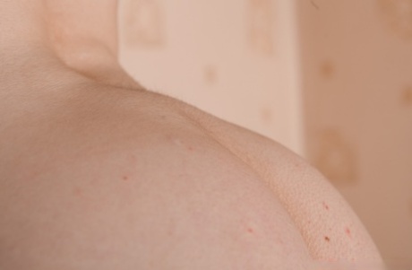 Brunette babe with a nice ass Marceline Moore flaunts her big tits and bush