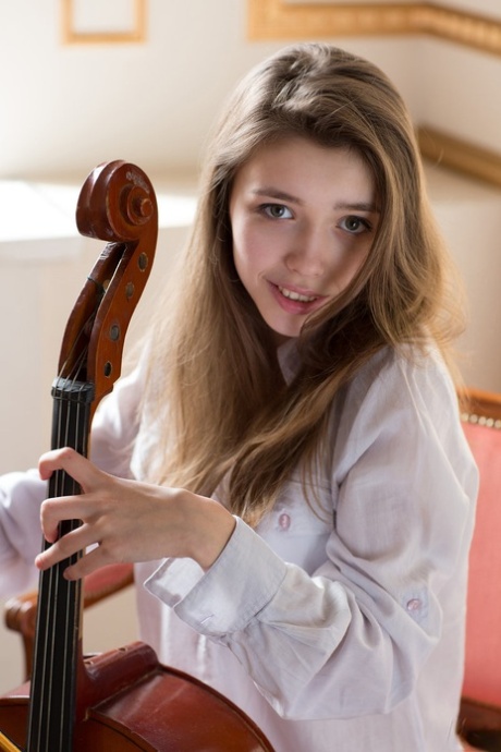 Cute teen girl Milla puts here cello away and opts for a nude modeling career