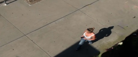 Oblivious busty Karmen Jay's big tits captured in downblouse voyeur photos