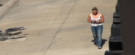 Oblivious busty Karmen Jay's big tits captured in downblouse voyeur photos