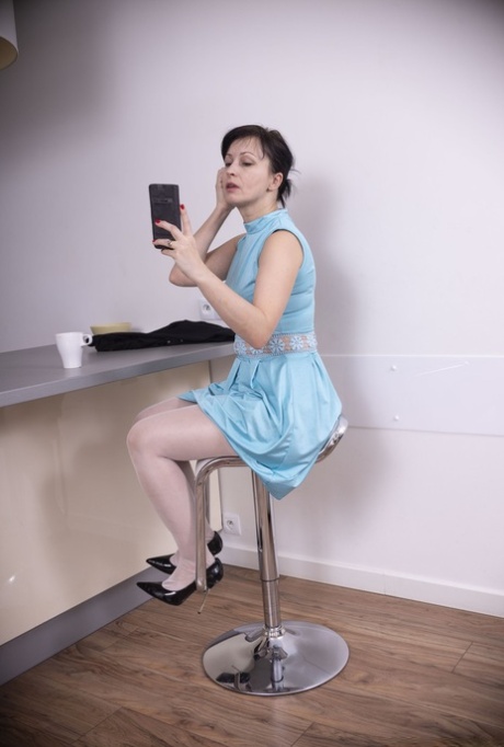 Lovely brunette Nikita shows her welcoming hairy pussy in stockings