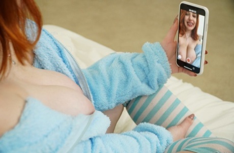 Redhead babe Annabel Redd shows her big tits and blows stiff prick in her room