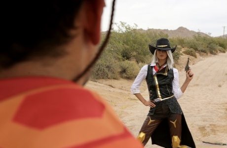 Thin girl Emma Hix licks jizz from a finger after cosplay sex on scrub land