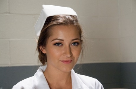 Gorgeous nurse with a nice butt Dani Daniels strips and poses in high heels