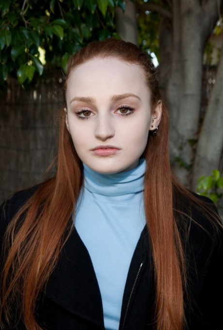 Stunning redhead teen Sarah Rupe flashing an upskirt in white panties outdoors