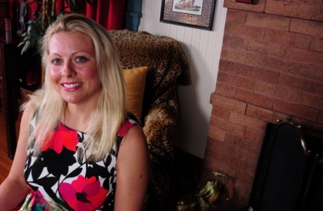 Blonde American housewife strips to black lingerie and stockings