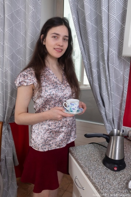 Brunette amateur Nancy Drew exposes her bushy armpits and twat in a solo