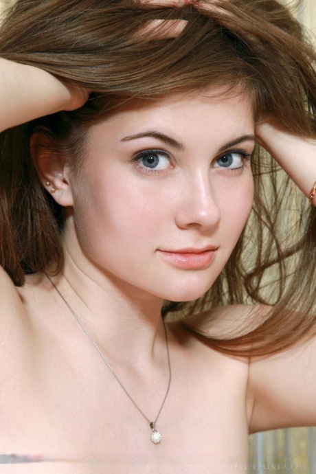 Glamourous Euro teen Marta E revealing full all natural teen breasts