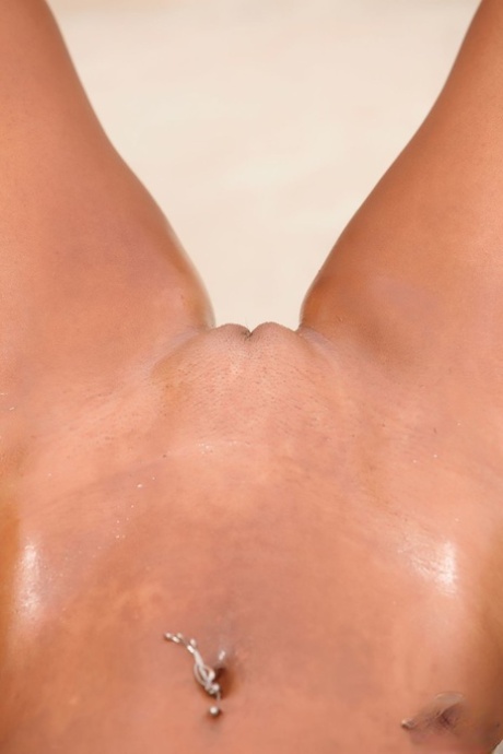 Fitness queen Megan Avalon flaunts her big tits while posing & flexing outside